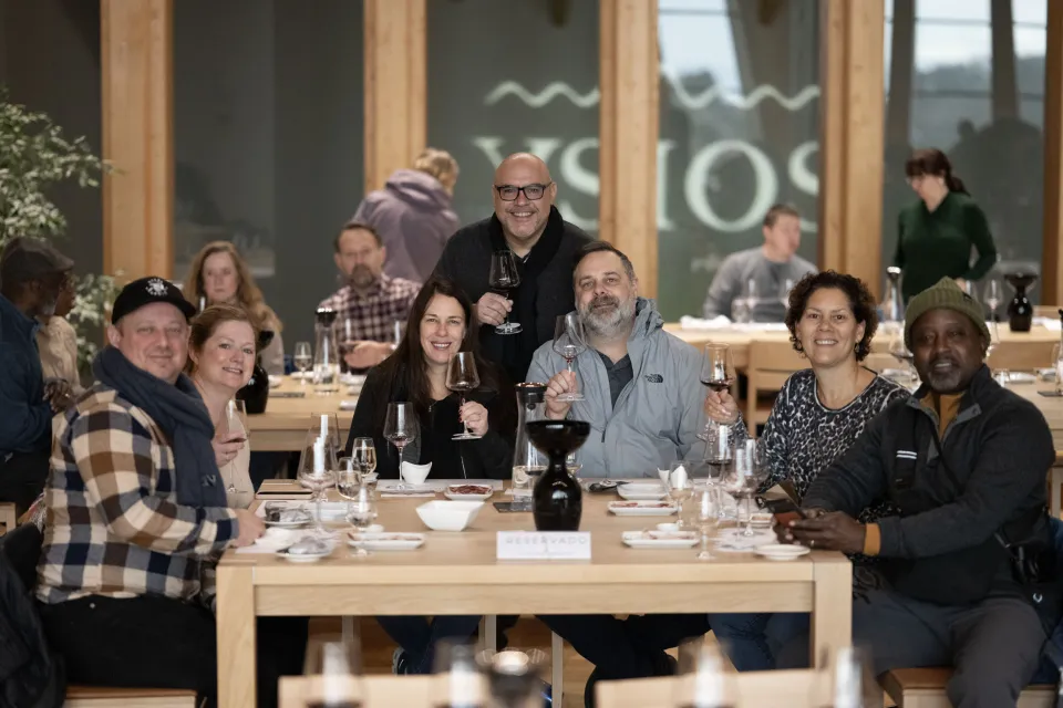 Gourmet Vacation travelers gathered around a restaurant table